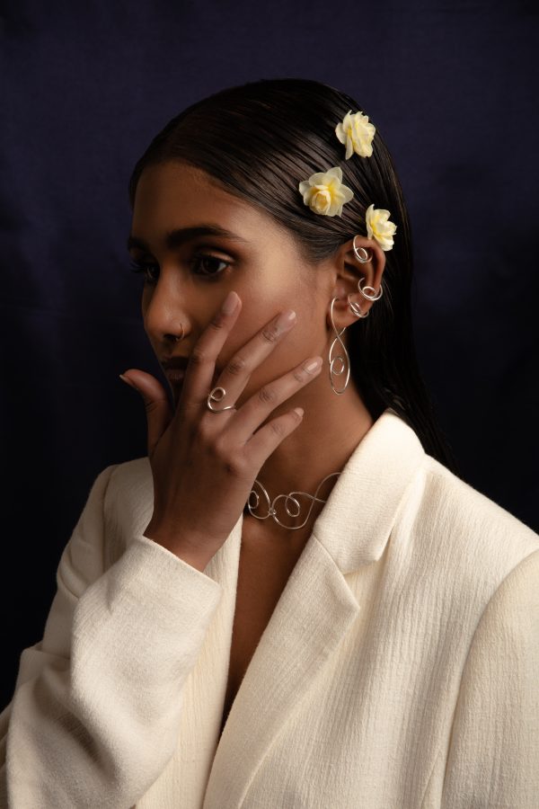 model wears dynasty ring, prevail choker, prevail ear cuff and elevate ear cuffs