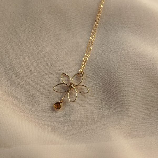 Gold flora necklace with yellow gem