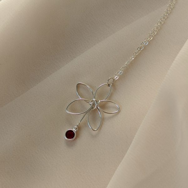 Silver flora necklace with red gem